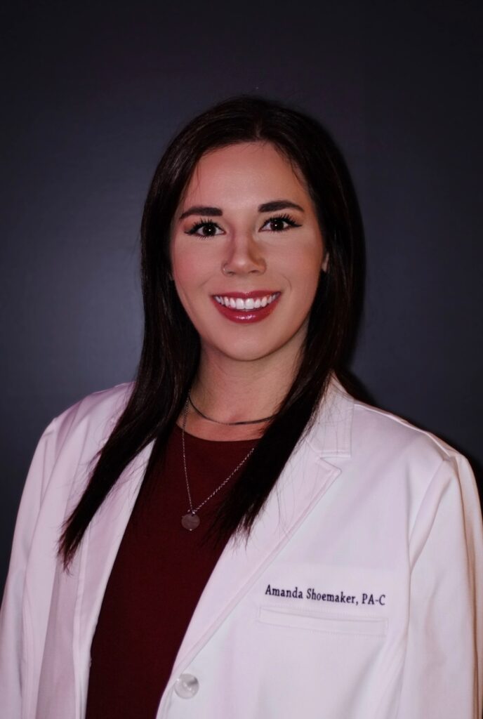 Headshot of Amanda Shoemaker in a white medical jacket